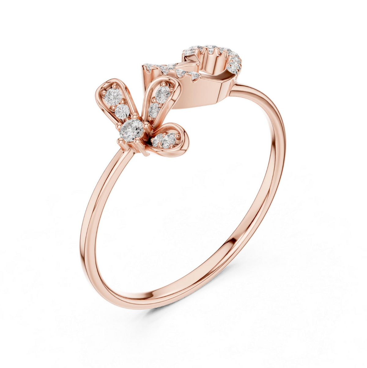 A rose gold ring featuring a butterfly and heart design paved with small clear gemstones, set against a clean white background.