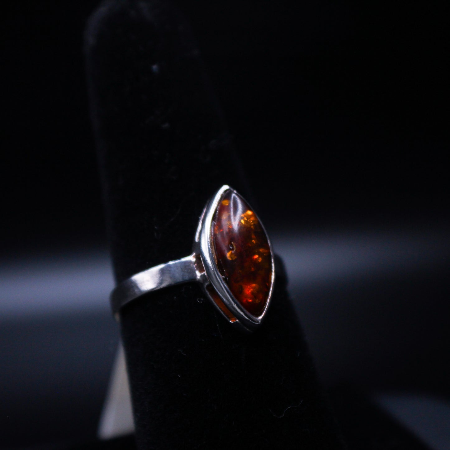 Johnny's Ice & Co SC-5000 Marquise cut Amber V2 ring featuring a marquise-shaped amber gemstone set in a sleek silver band.