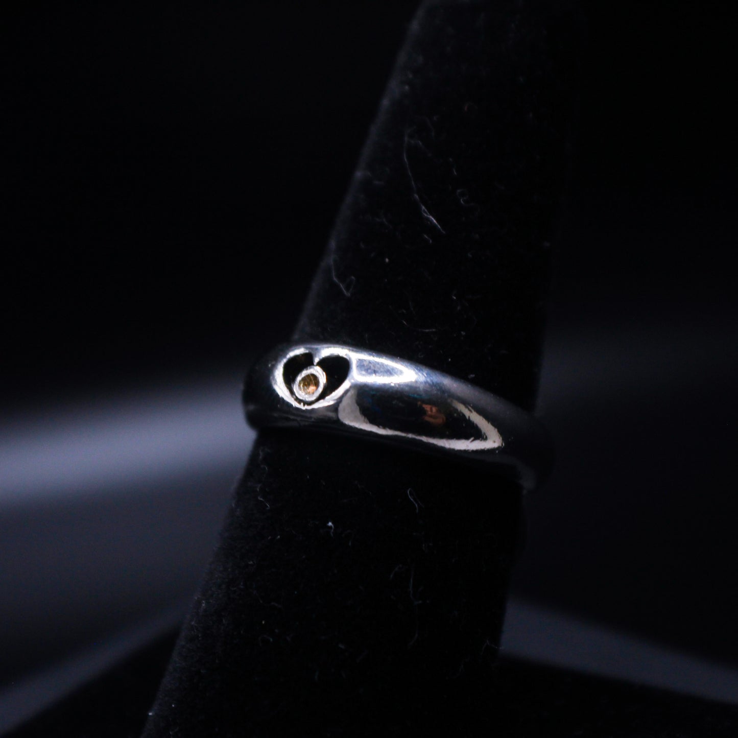 Silver heart ring from Johnny's Ice & Co, featuring a polished silver band with a heart-shaped design for elegant wear