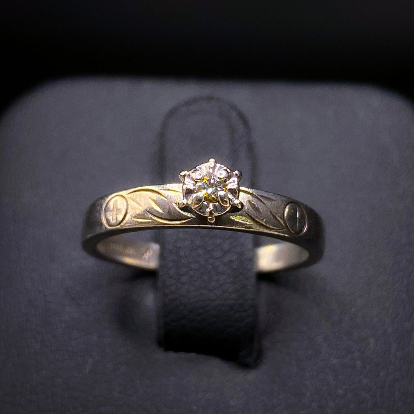Silver diamond ring by Johnny's Ice & Co featuring a sparkling diamond set in a sleek silver band.