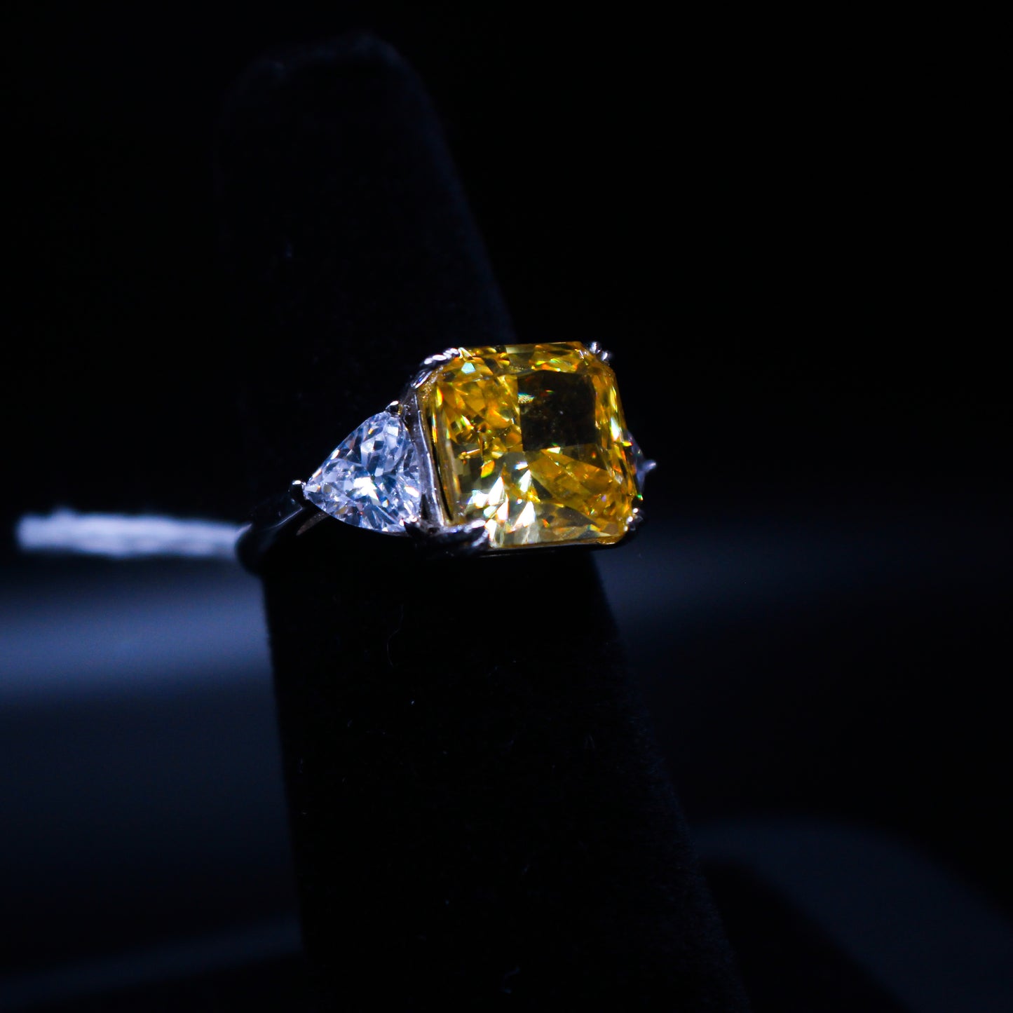 Radiant yellow ring from Johnny's Ice & Co, featuring a sleek design and vibrant yellow color, displayed on a white background.