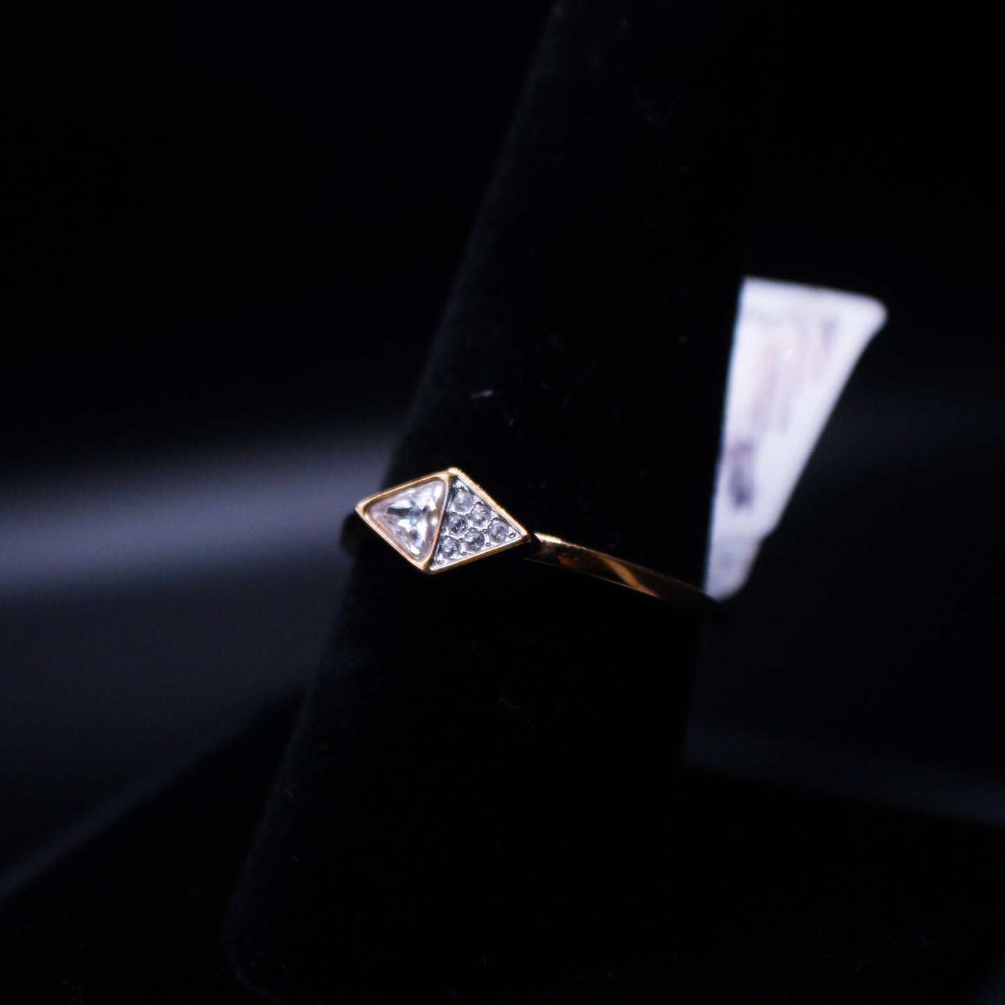 Silver ring featuring double triangular gems, designed by Johnny's Ice & Co, with intricate gemstone details and polished band.