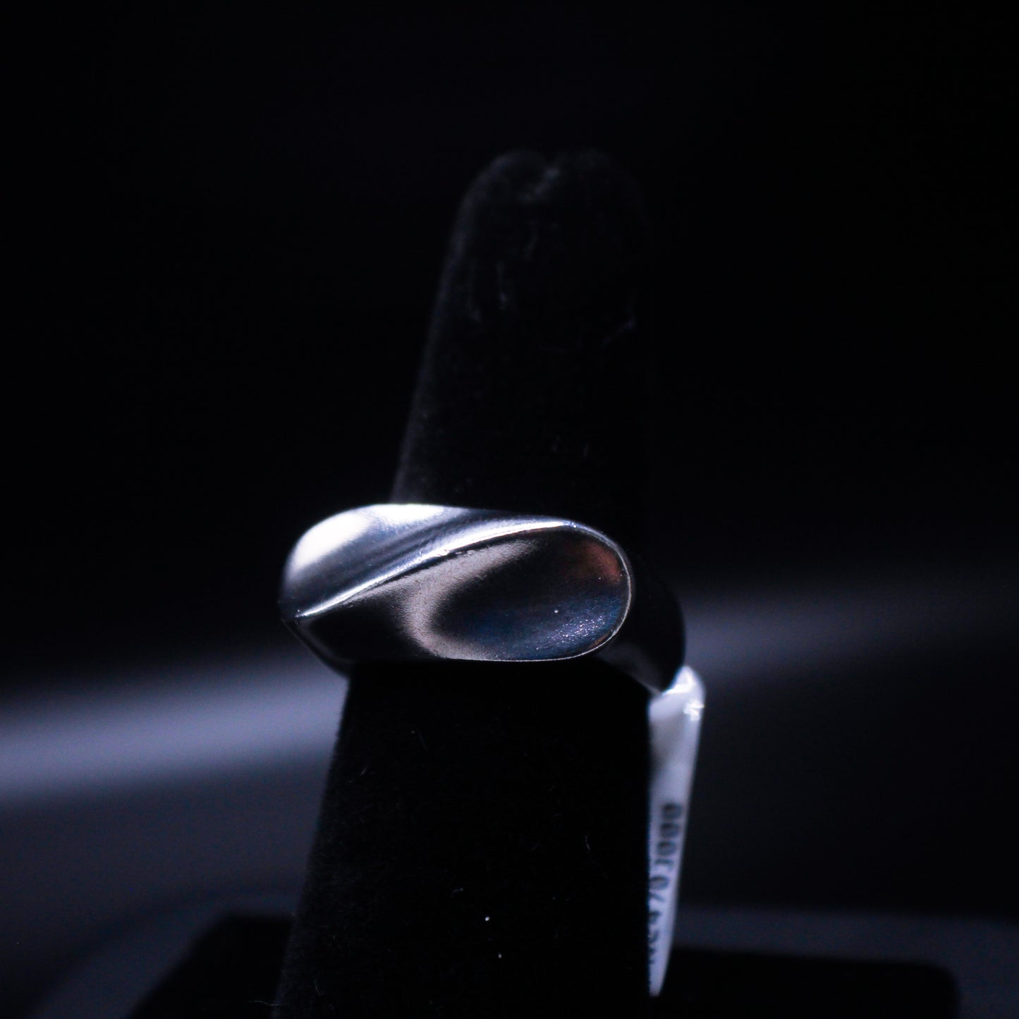 Stainless Waves rings by Johnny's Ice & Co, featuring sleek stainless steel band with wave design on a white background.
