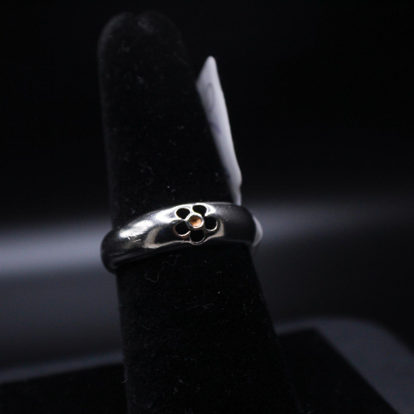 Silver flower ring from Johnny's Ice & Co, featuring intricate floral design in sterling silver on a clean background.