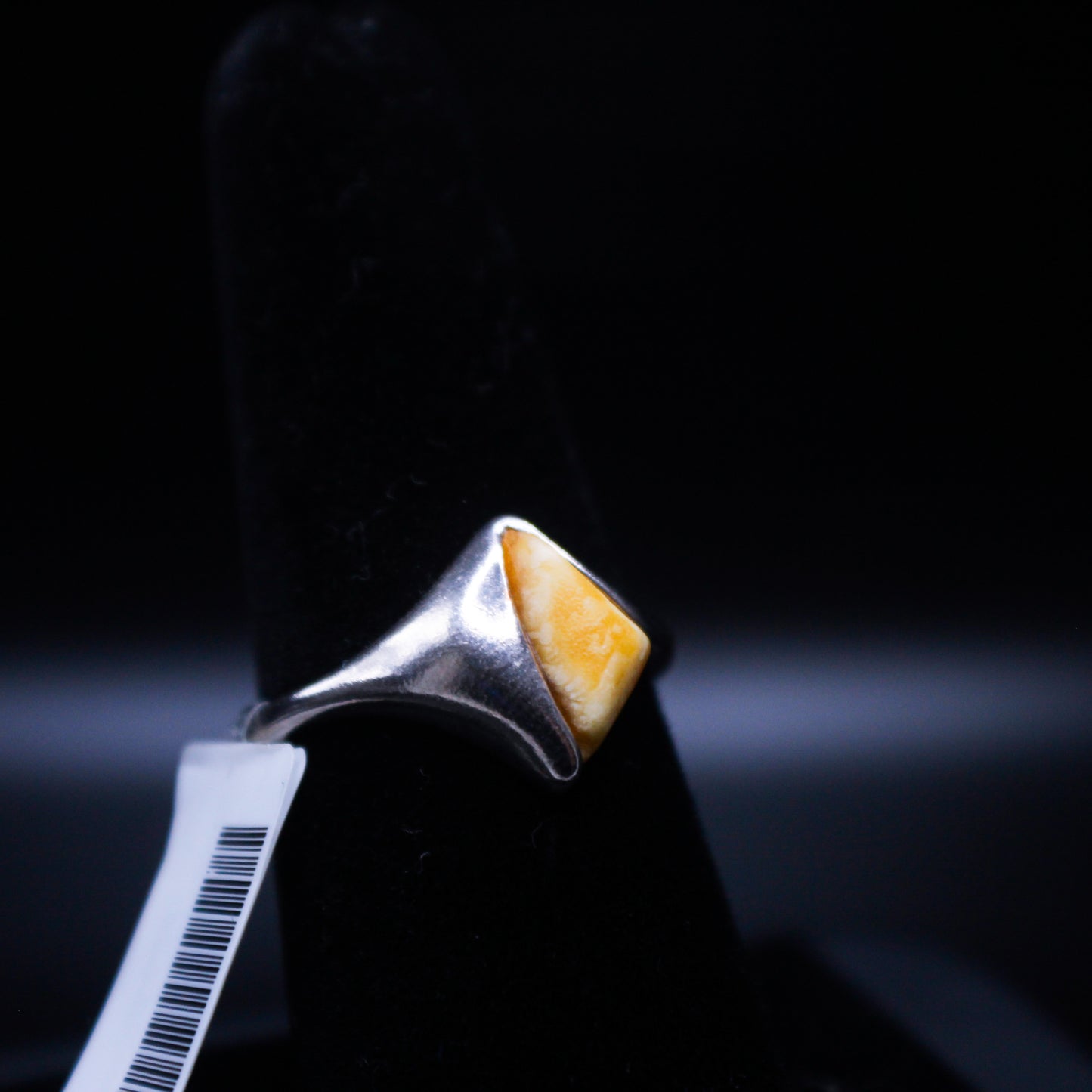 Amber V2 triangular cut ring from Johnny's Ice & Co, featuring a unique amber gemstone design and silver band.