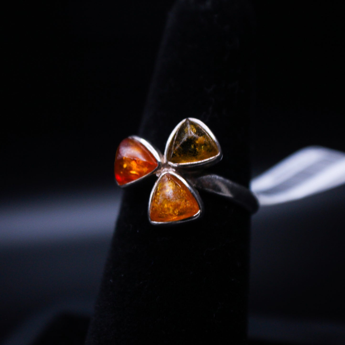 Amber cut triple triangular ring by Johnny's Ice & Co featuring a unique geometric design and warm amber color.