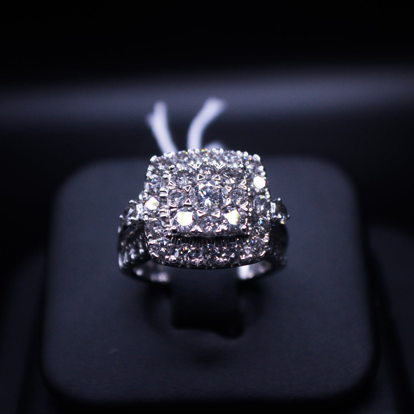 Johnny's Ice & Co JI-2050 cushion cut ring featuring a sparkling central gemstone and intricate band design.