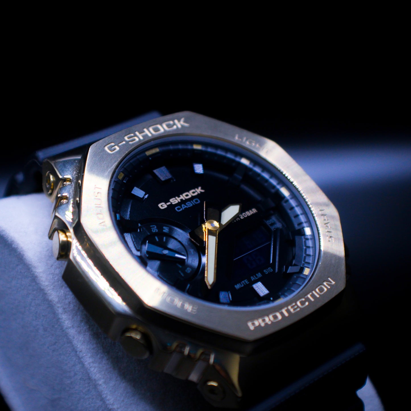 Johnny's Ice & Co GM2100M-1A watch featuring a sleek design with a black dial and stainless steel band, displayed on a white background.