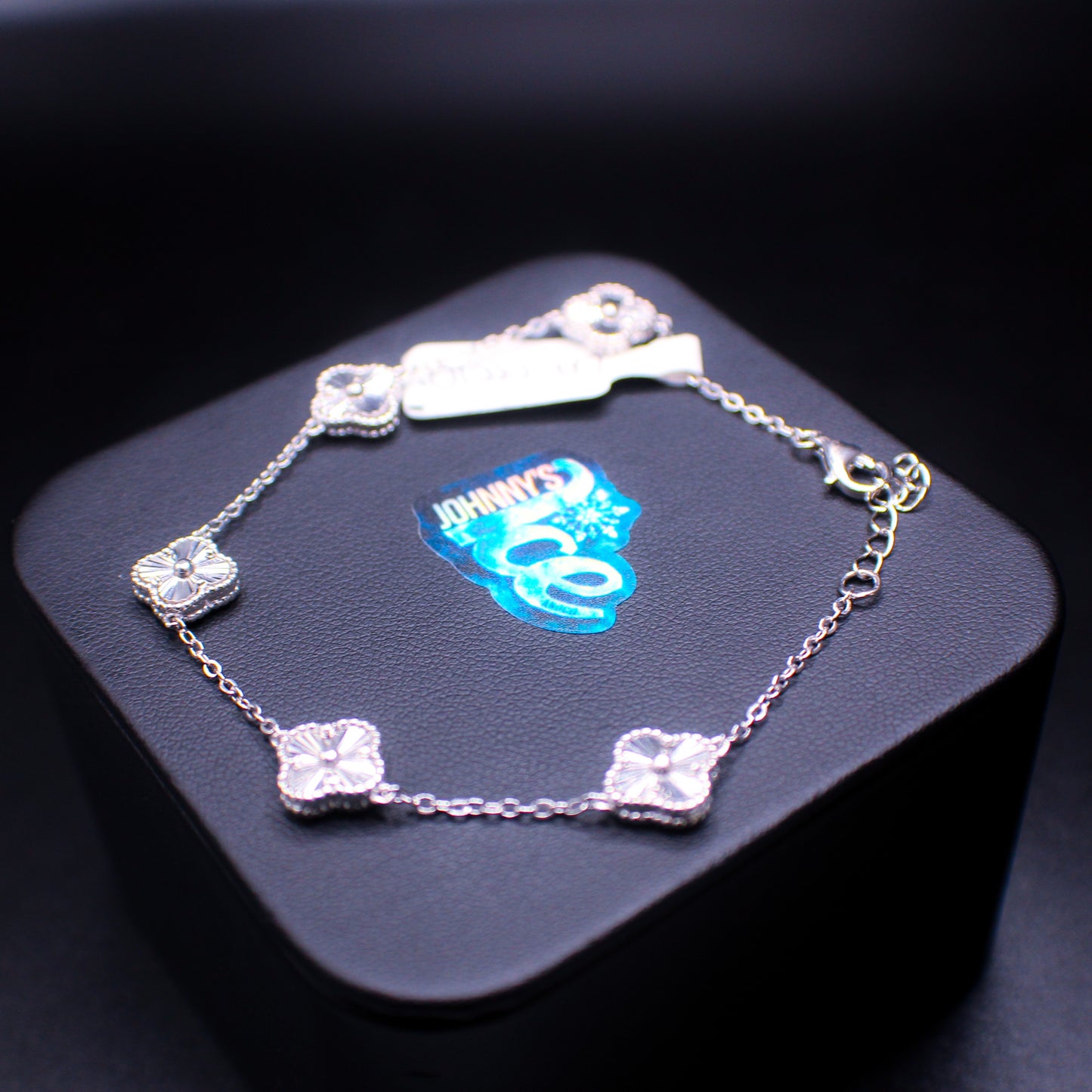 Silver bracelet from Johnny's Ice & Co's Van Cleef Custom.925 collection, featuring intricate design details and a polished finish.