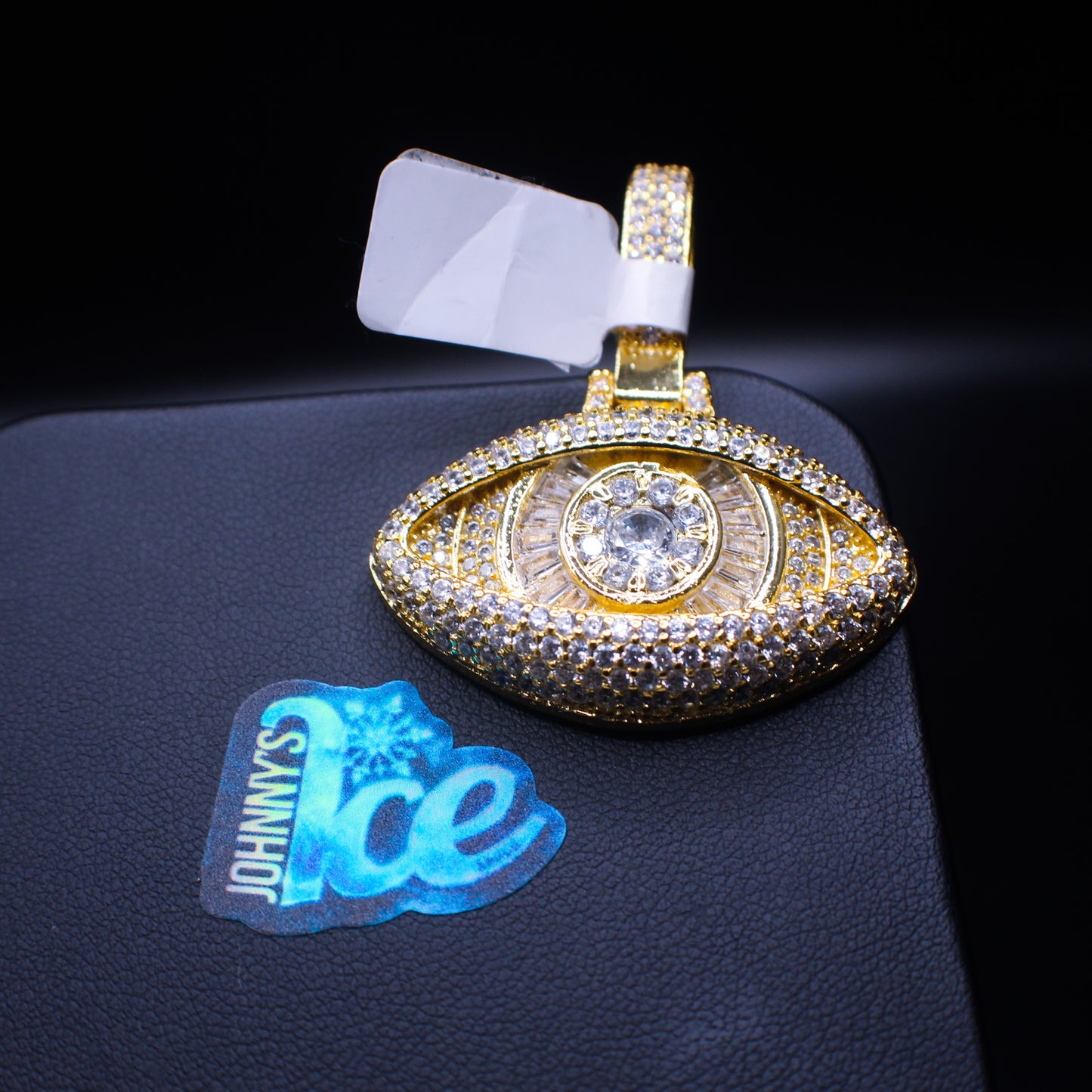 Yellow baguette eye jewelry piece from Johnny's Ice & Co featuring a vibrant yellow gemstone in a sleek setting.