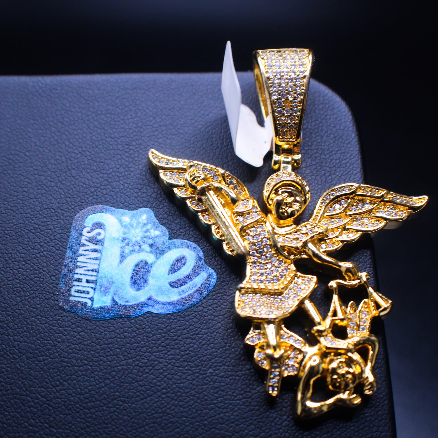 Angel sword from Johnny's Ice & Co featuring a sleek design with a shiny blade and ornate handle, displayed on a neutral background.