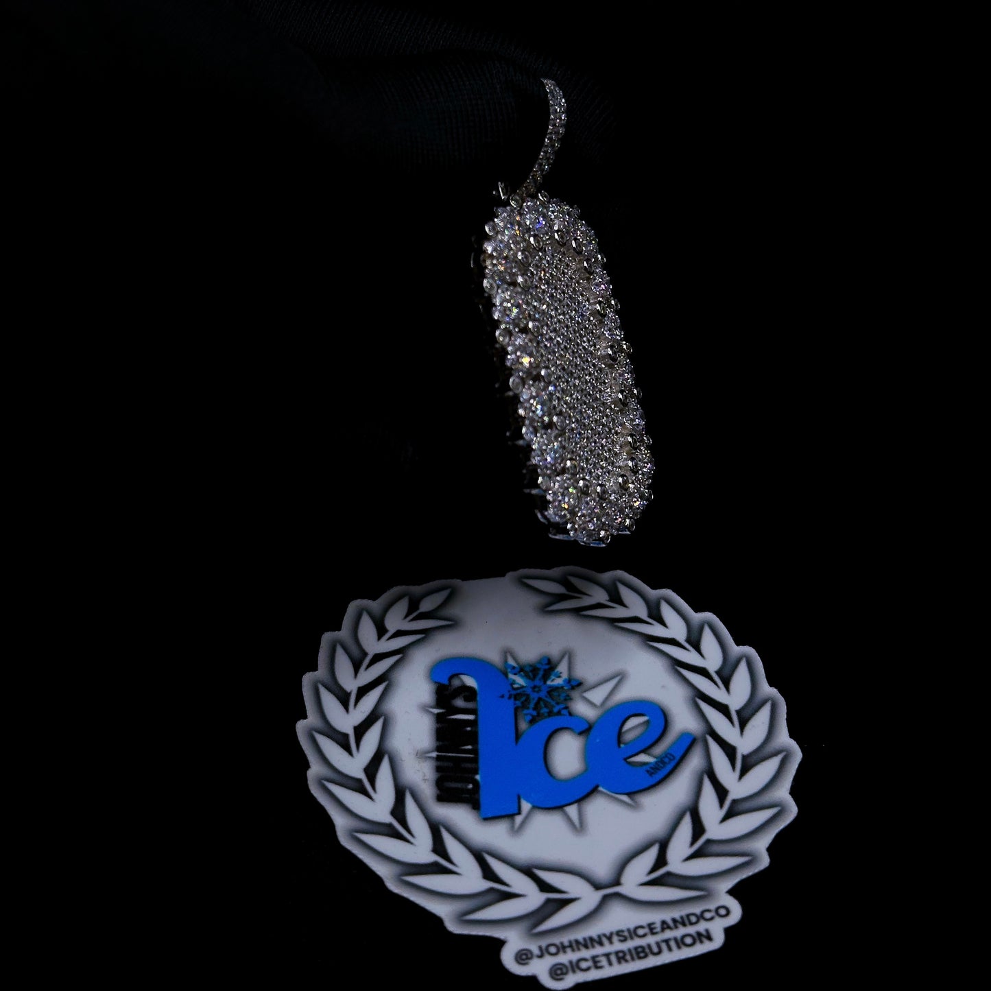 side view of silver dog tag pendant