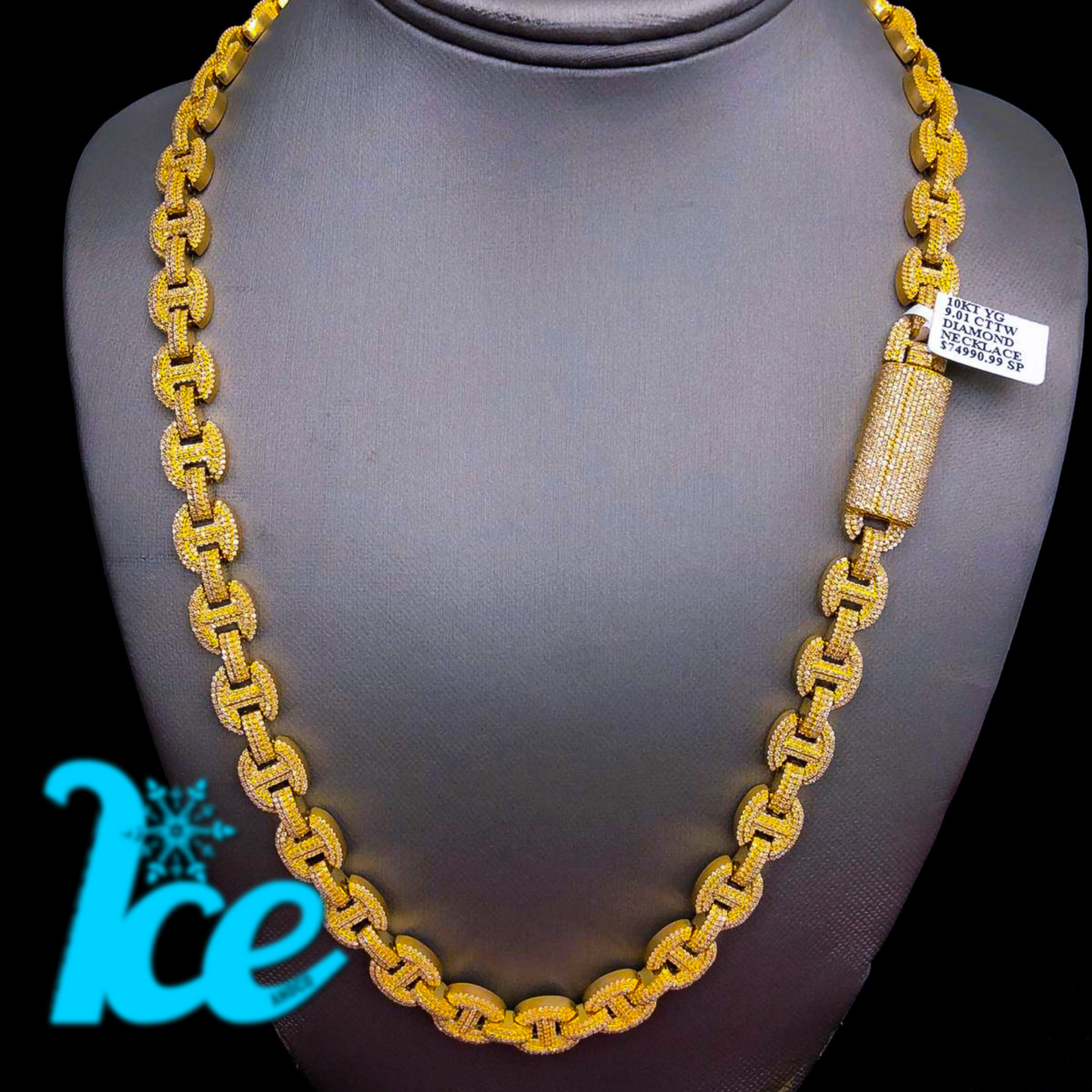 A gold flat gucci bean chain necklace displayed on a mannequin torso.
